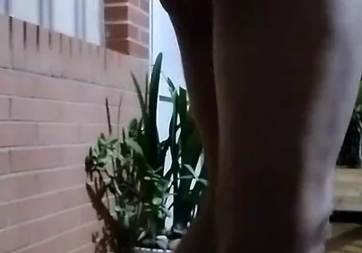 In the Doorway in a Thong and with an Anal Plug