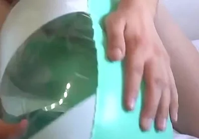 Playing with a Green and White Swimring