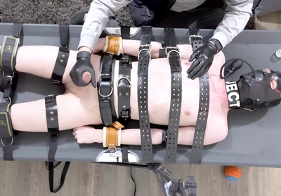 Rubber Twink Strapped Down and Made to Eat His Own Cum