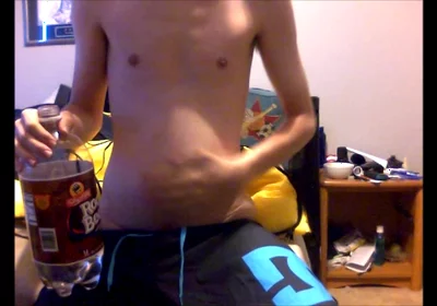 Young Guy Fills His Stomach with Water