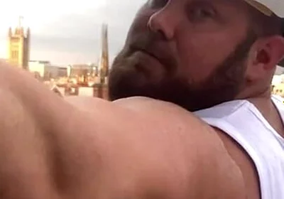 Builder Iron Bending Muscle Flexing and Measuring
